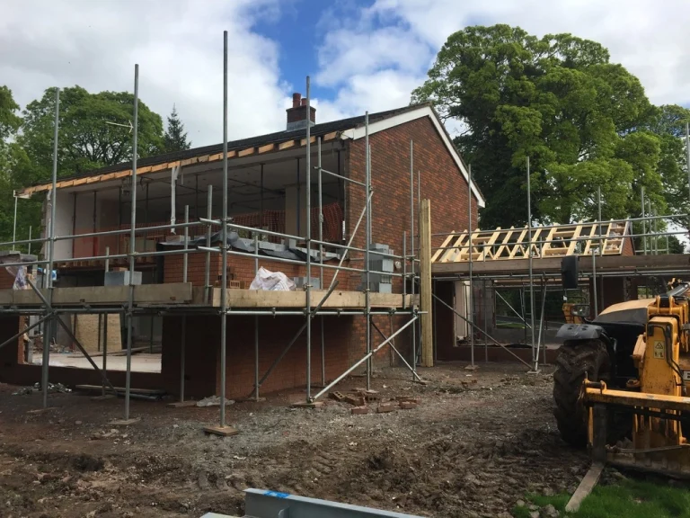 House extension under construction with scaffolding