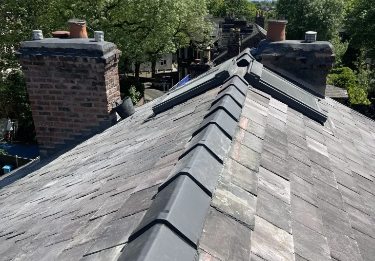 Pitched slate roof with new ridge and chimney stacks