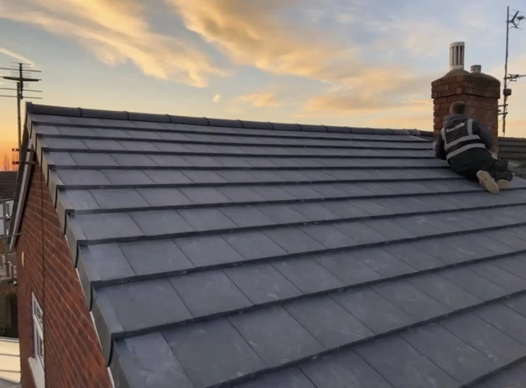 Pitched roof covered in dark concrete tiles
