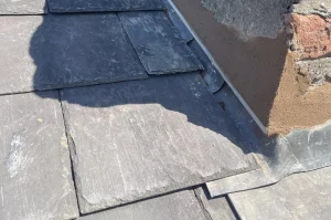 Lead flashing dressed over a slate roof