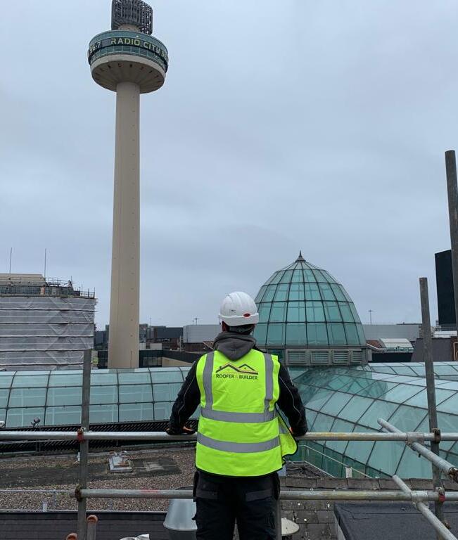Roofer & Builder operative working on a roof in Liverpool city centre