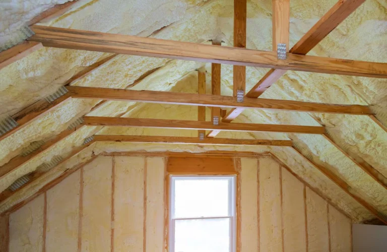 Loft insulation fitted between timber rafters