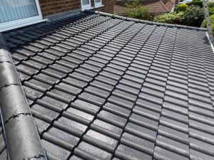 Close-up of a new grey tiled roof
